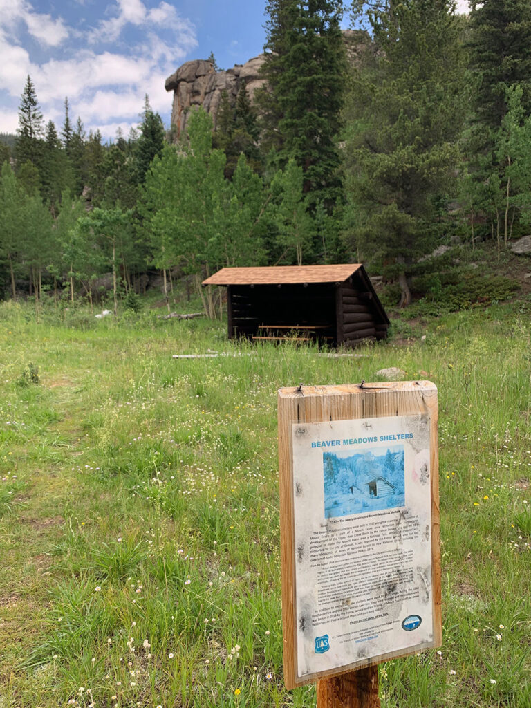 Historic shelter on Beaver Meadows trail with interpretive sign