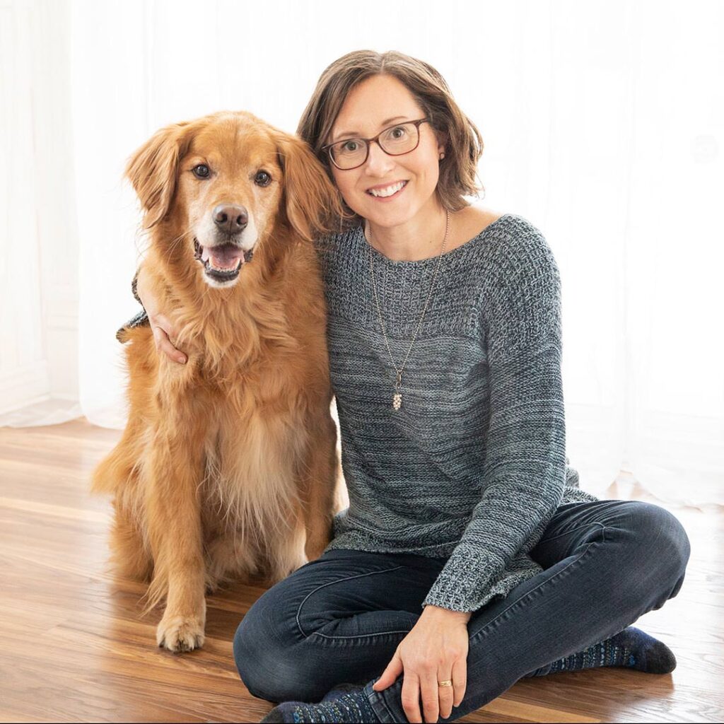 Karen Hoglund with her golden retriever dog