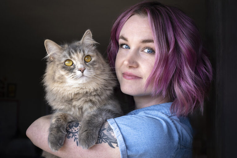 Cat and Owner Photoshoot. Siberian cat and young woman portrait at a cat photography session held in Denver, Colorado