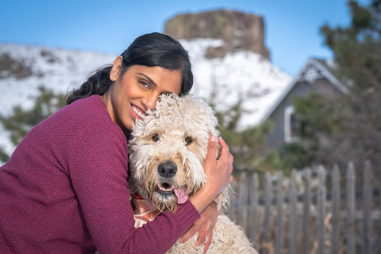 winter photoshoot at Golden History Park in Golden, Colorado - featuring a goldendoodle.