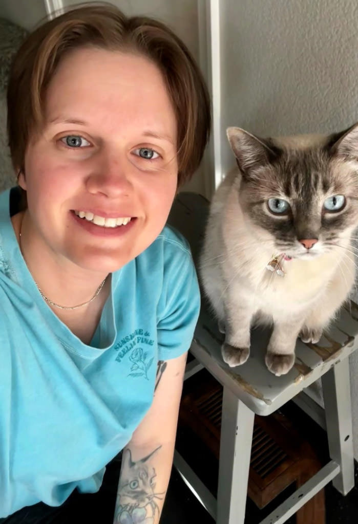 Kelsey Bailey owner of Sunny Spot Pet Care and her cat